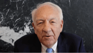 Image of man in suit and tie with a dark background